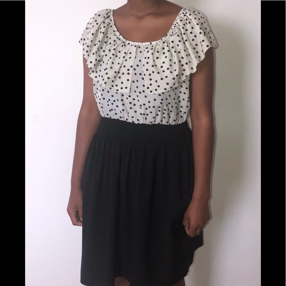This is a black and white dress with polka dots